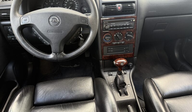 
								OPEL ASTRA pilns									